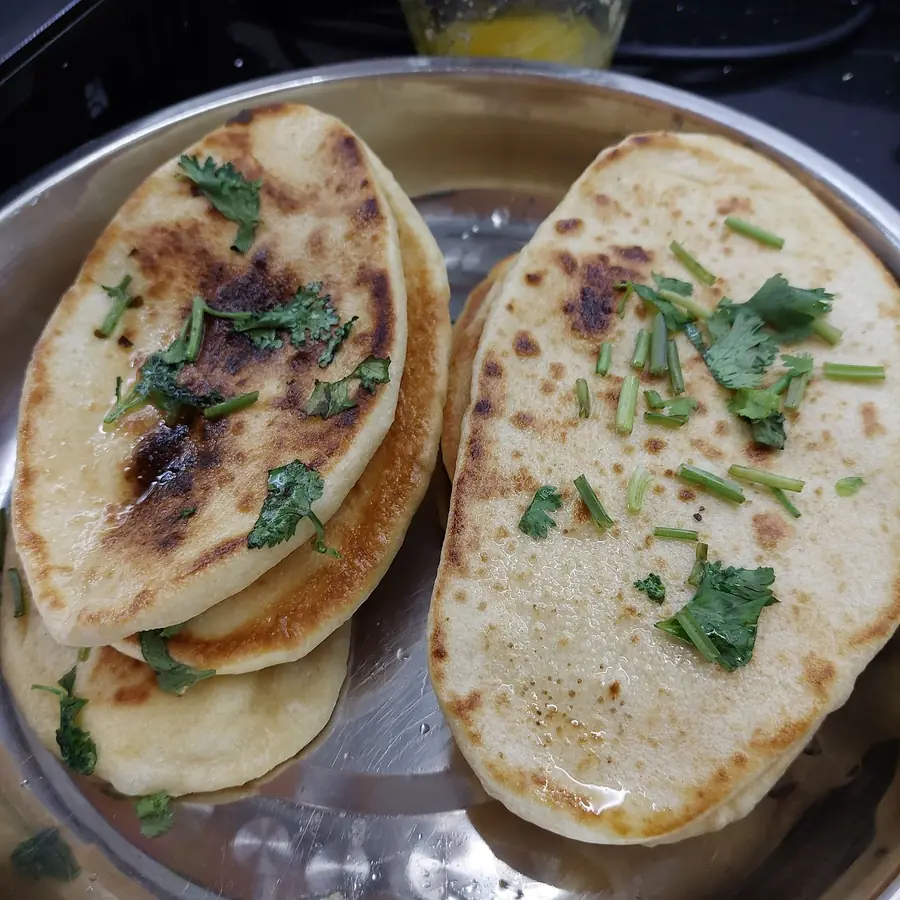 Pan-toasted flatbreads with fresh coriander and spring onion